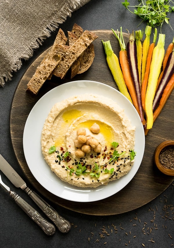 The Perfect 5 Minute Hummus Recipe You have to try this hummus! So much better than anything you buy in the store! This homemade hummus tastes fresh and delicious and it's the perfect snack for your Christmas meal.