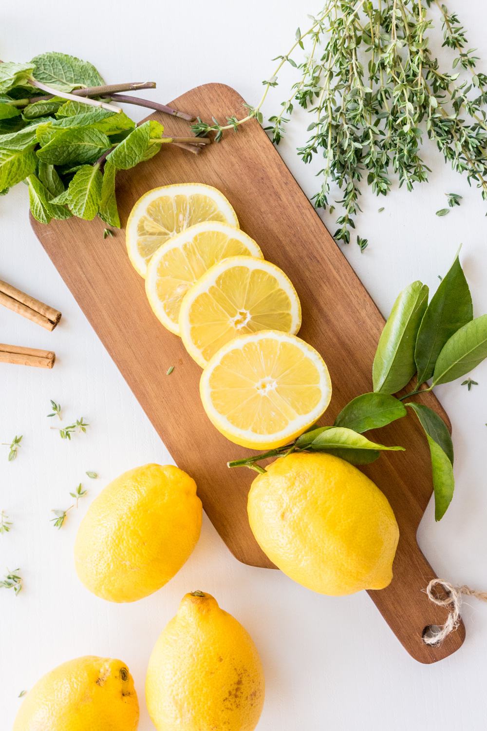 Lemon, Cinnamon, Mint And Thyme&nbsp;Stove Top Potpourri | These Stove Top Potpourri ideas create an amazing natural homemade scent that will bring the smell of spring into your home. Such easy recipes that you can leave on your stove all day long simmering. Each one will fill your home with a fresh aroma as you do your spring cleaning!