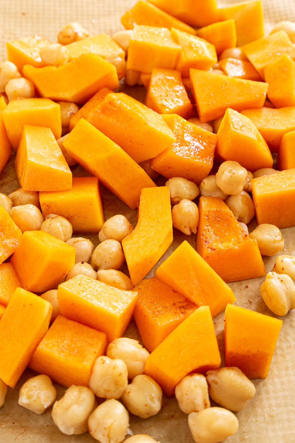 Butternut squash and chickpeas on a baking tray