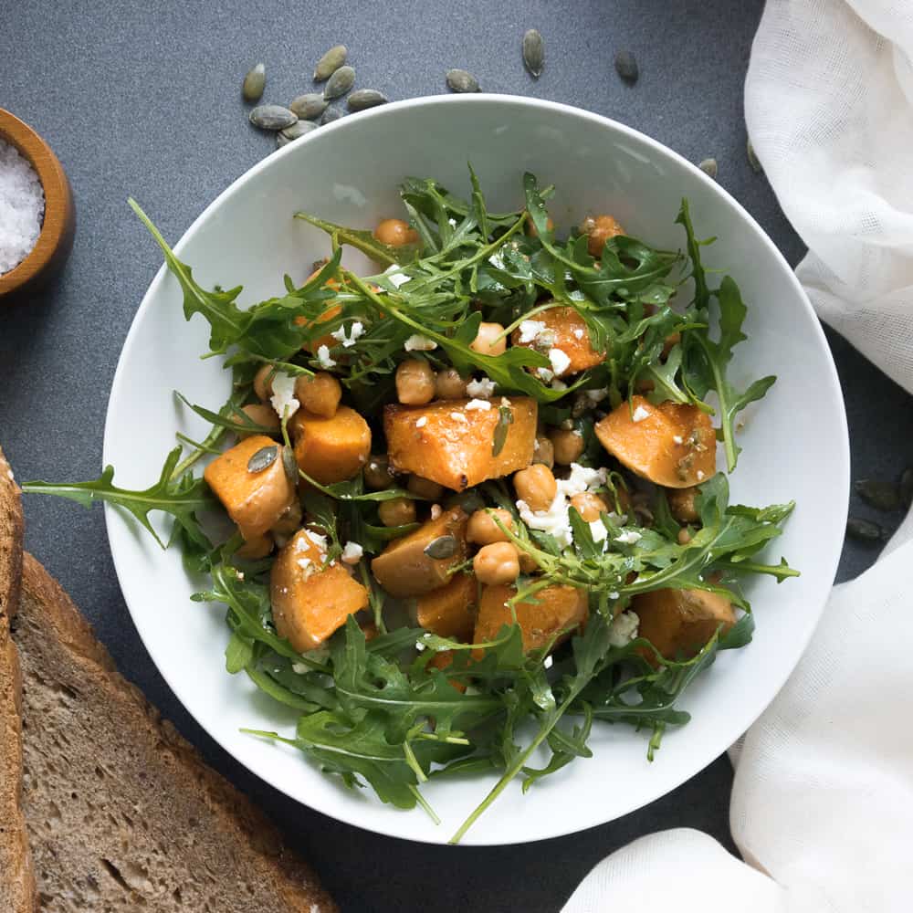 This roasted butternut squash salad with feta is warm and delicious. It's healthy, easy to make and tastes amazing! The perfect fall recipe!