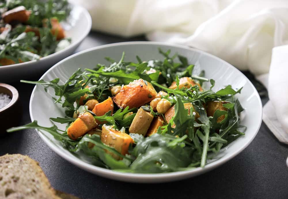 This roasted butternut squash salad with feta is warm and delicious. It's healthy, easy to make and tastes amazing! The perfect fall recipe!