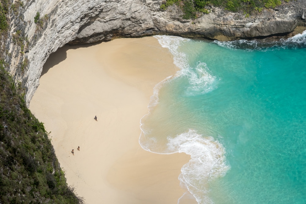 Aerial view of a beach in Nusa Penida, Bali. Find local places to visit is a perfect travel hack!