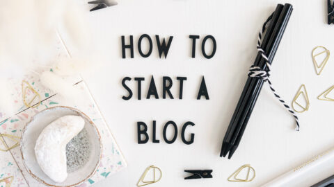 Desk with letters saying "How To Start A Blog"