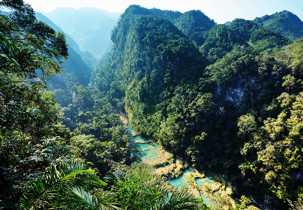 Beautiful natural pools in Semuc Champey, Lanquin, Guatemala: one of the cheapest destinations to visit in the world!