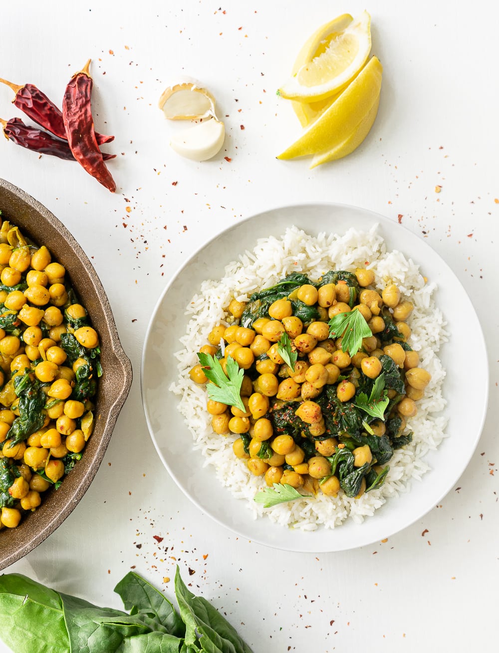 A plate with basmati rice and delicious spinach and chickpea curry ready to eat.