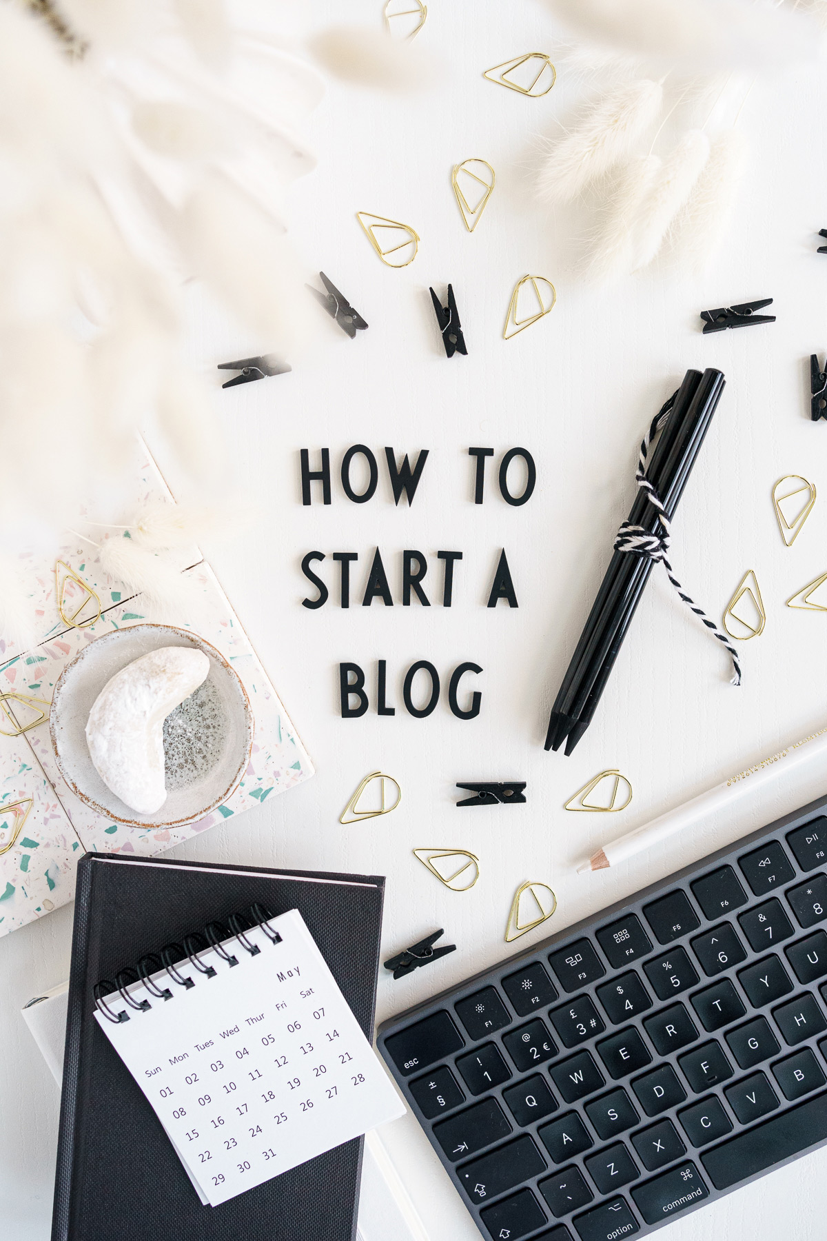 Desk with words saying "How to start a blog"