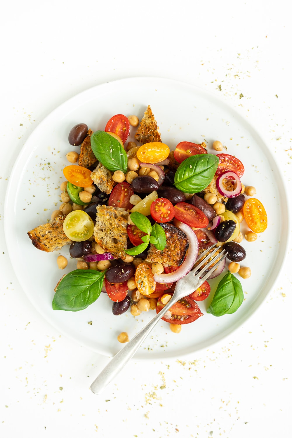 Top view of Panzanella in a plate: a salad made with tomatoes and stale bread. 