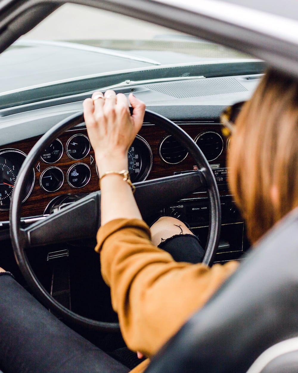 Woman driving in a vintage car! 