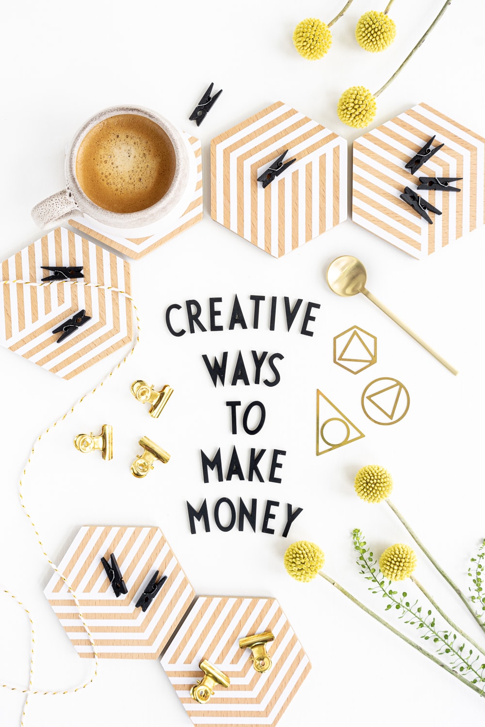 Top view of desk with black letters saying "creative ways to make money"