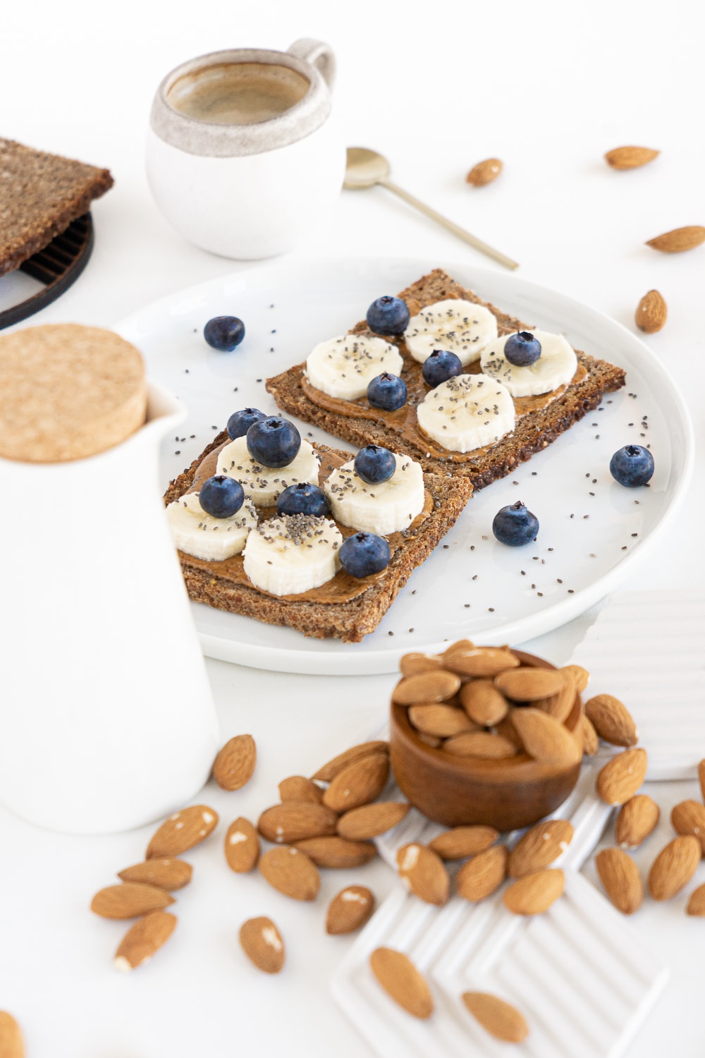 Rye bread with almond butter, bananas, blueberries and chia seeds
