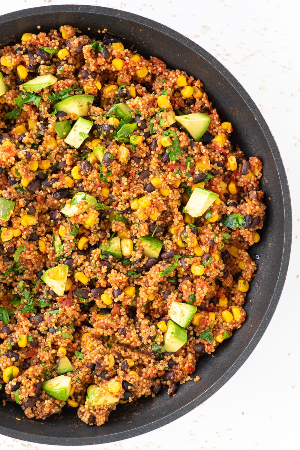 Top view of a black pan filled with Mexican quinoa