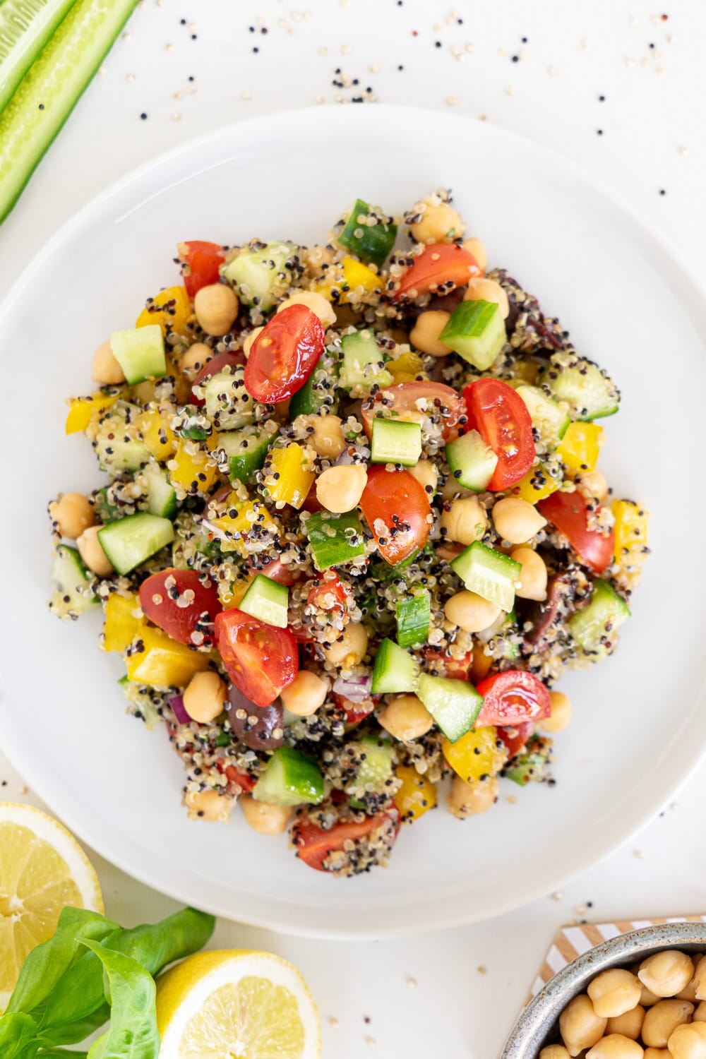 Top view of white plate with Mediterranean quinoa salad