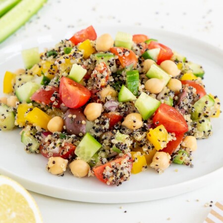 Three quarter view of Mediterranean Quinoa salad on a while plate