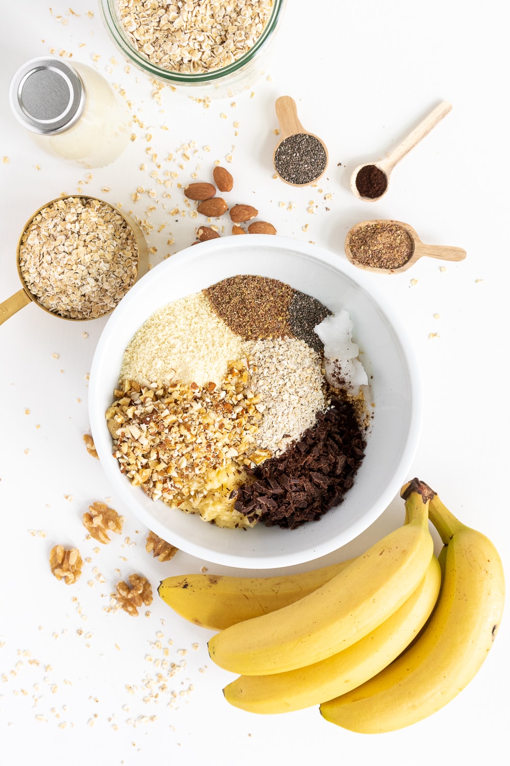 Top view of a white ball with all the ingredients to make breakfast cookies