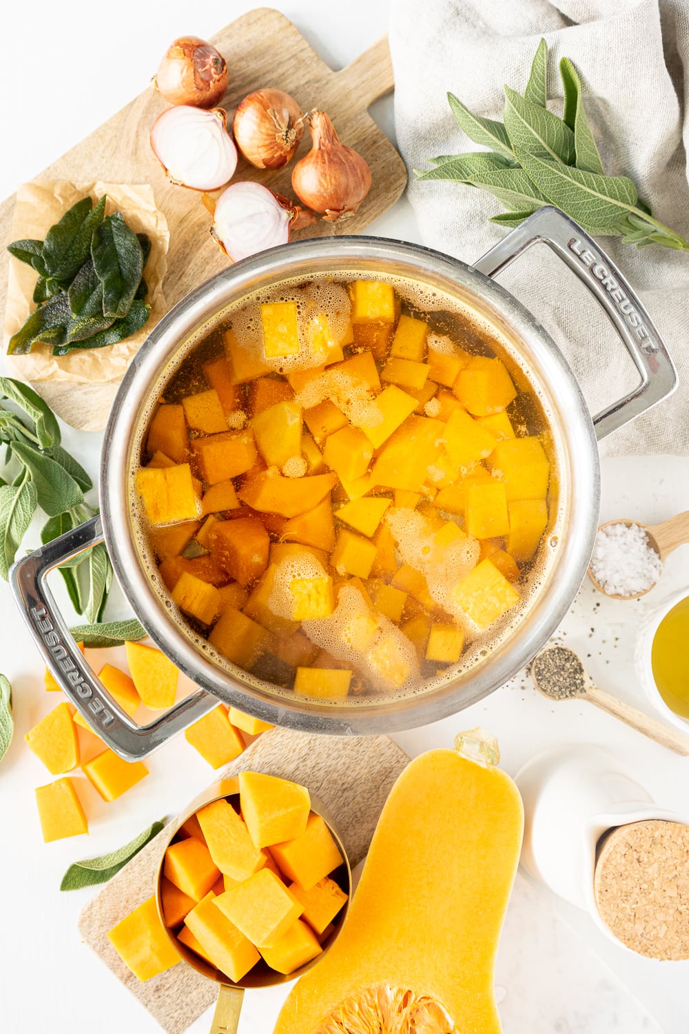 Top view of pot with boiling water and butternut squash