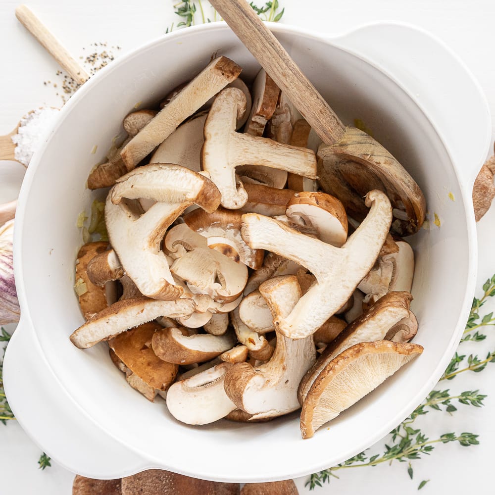 Top view of white pot with mushrooms