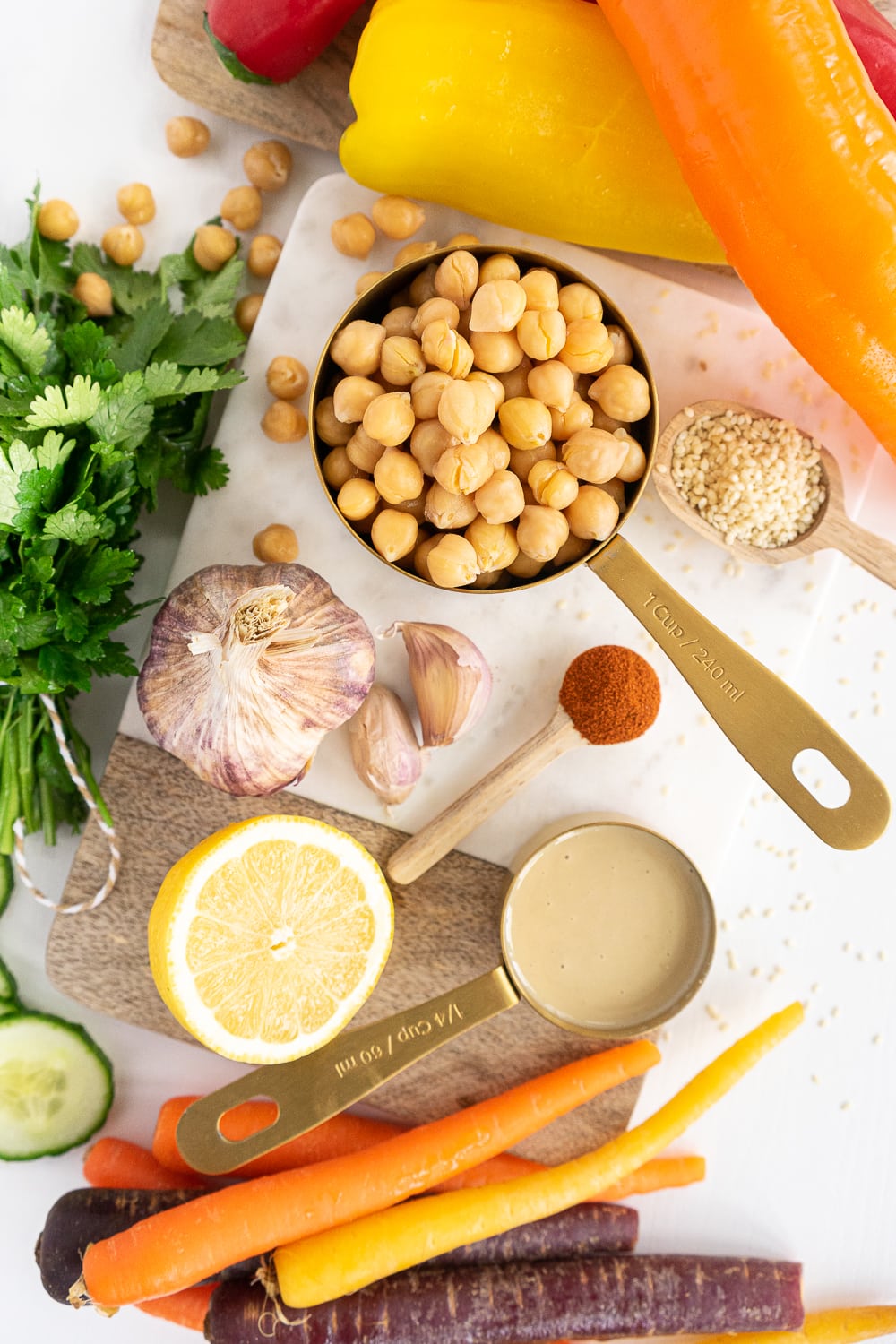 Ingredients to make an easy hummus recipe: chickpeas, tahini, lemon, garlic