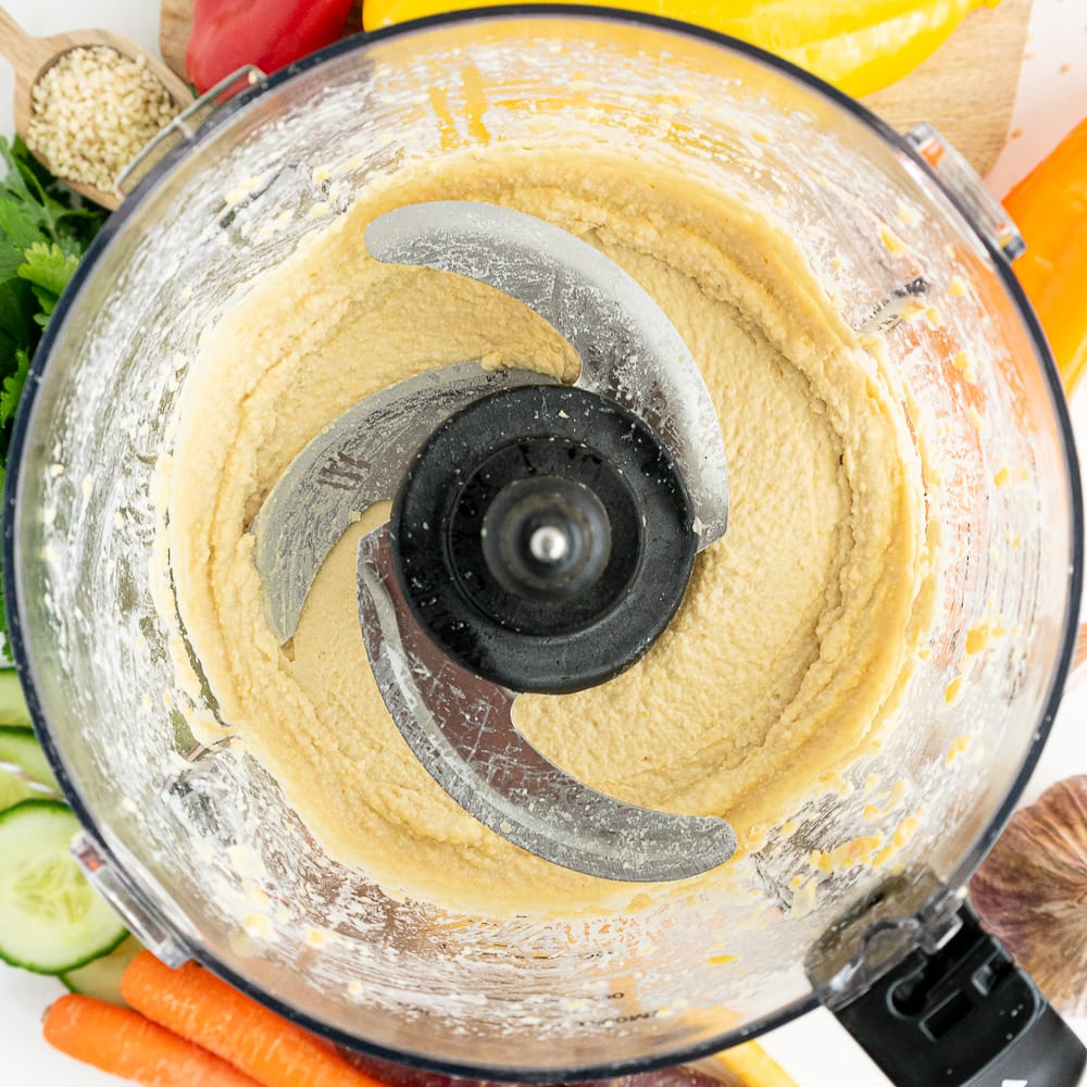 top view of food processor with hummus