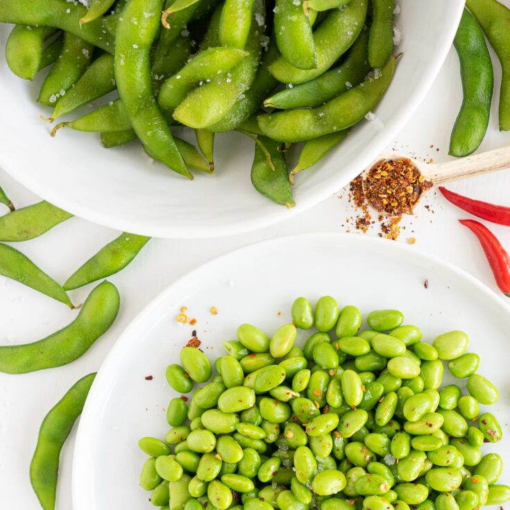 Top view of plates with edamame beans