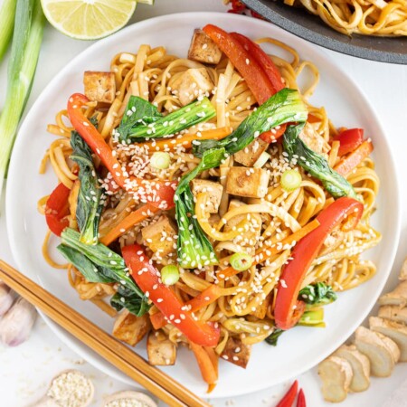 Top view of plate with vegan noodles with crispy tofu