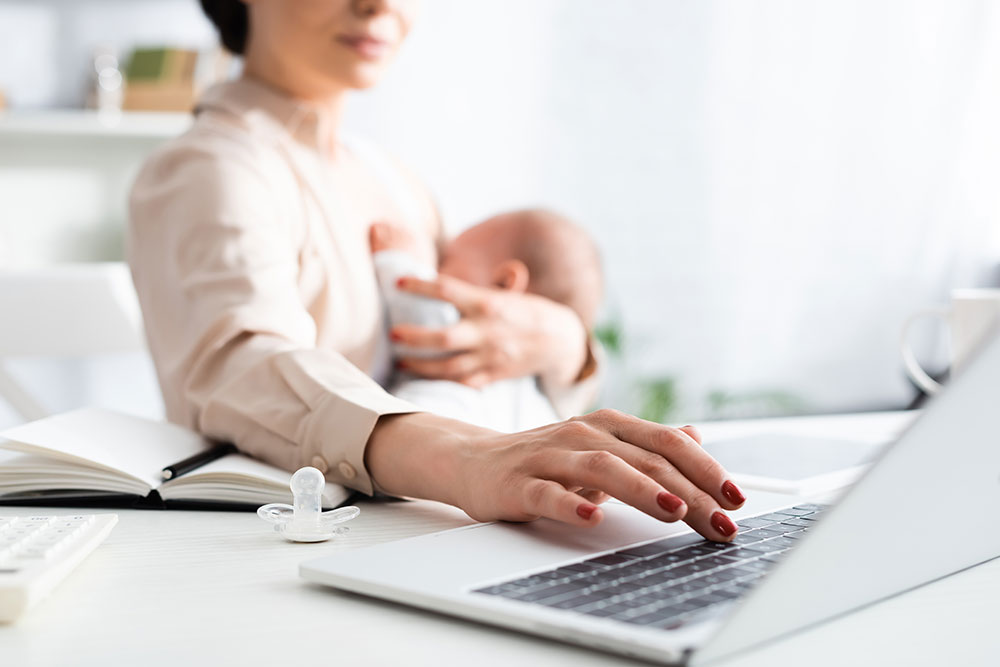 A photo of a woman with a baby as an example of the top stock photos to sell online