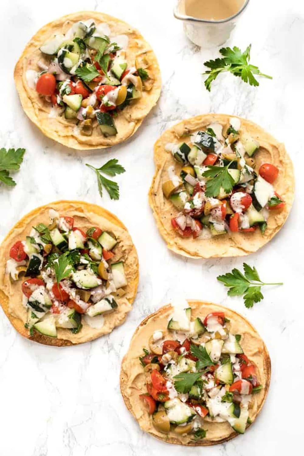 10-Minute Mediterranean Tostadas by Simply Quinoa