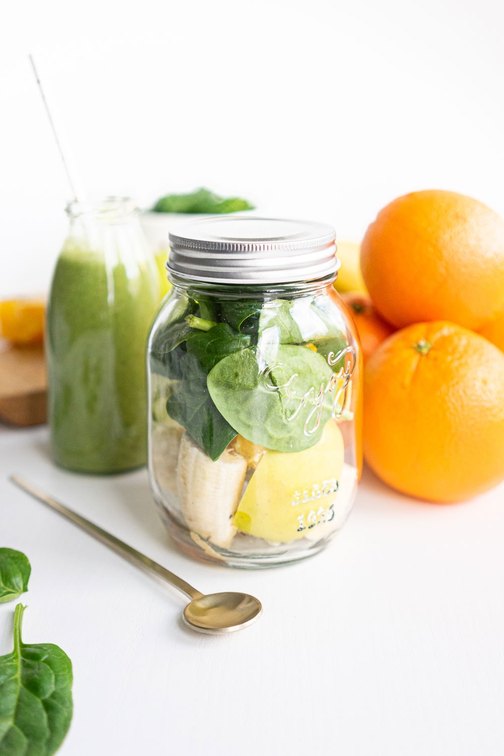 Jar with ingredients to make a green smoothie