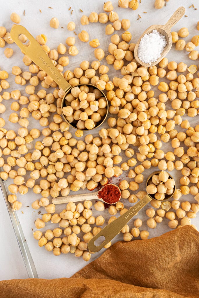 Chickpeas on a baking sheet with parchment paper