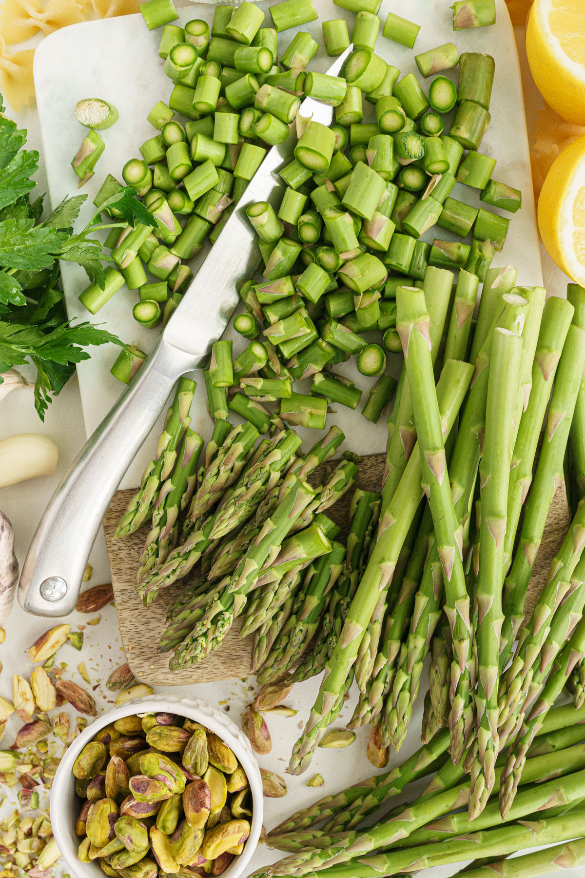 Close up of chopped asparagus on a cutting board