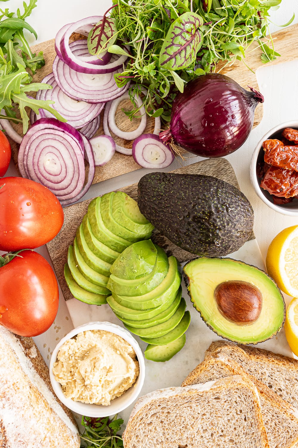 Top view of ingredients needed to make an avocado sandwich