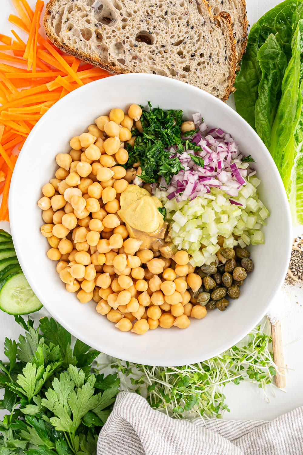 Top view of bowl containing all ingredients to make chickpea salad