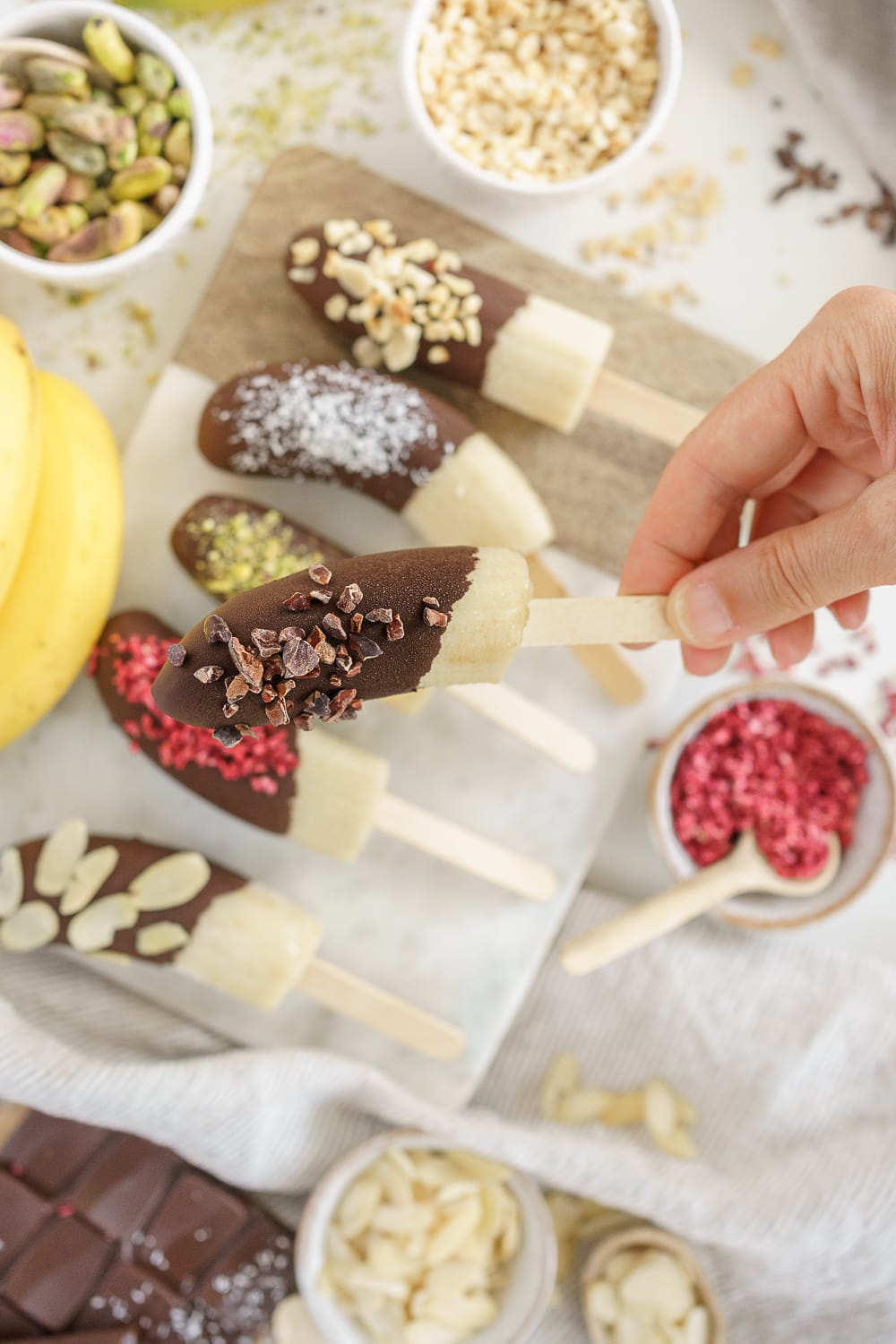 hand holding a chocolate banana