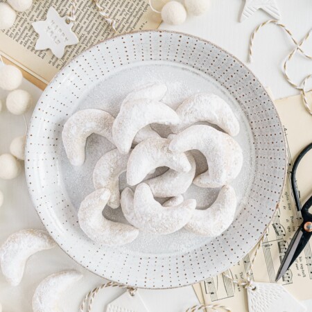 almond crescent cookies on a plate