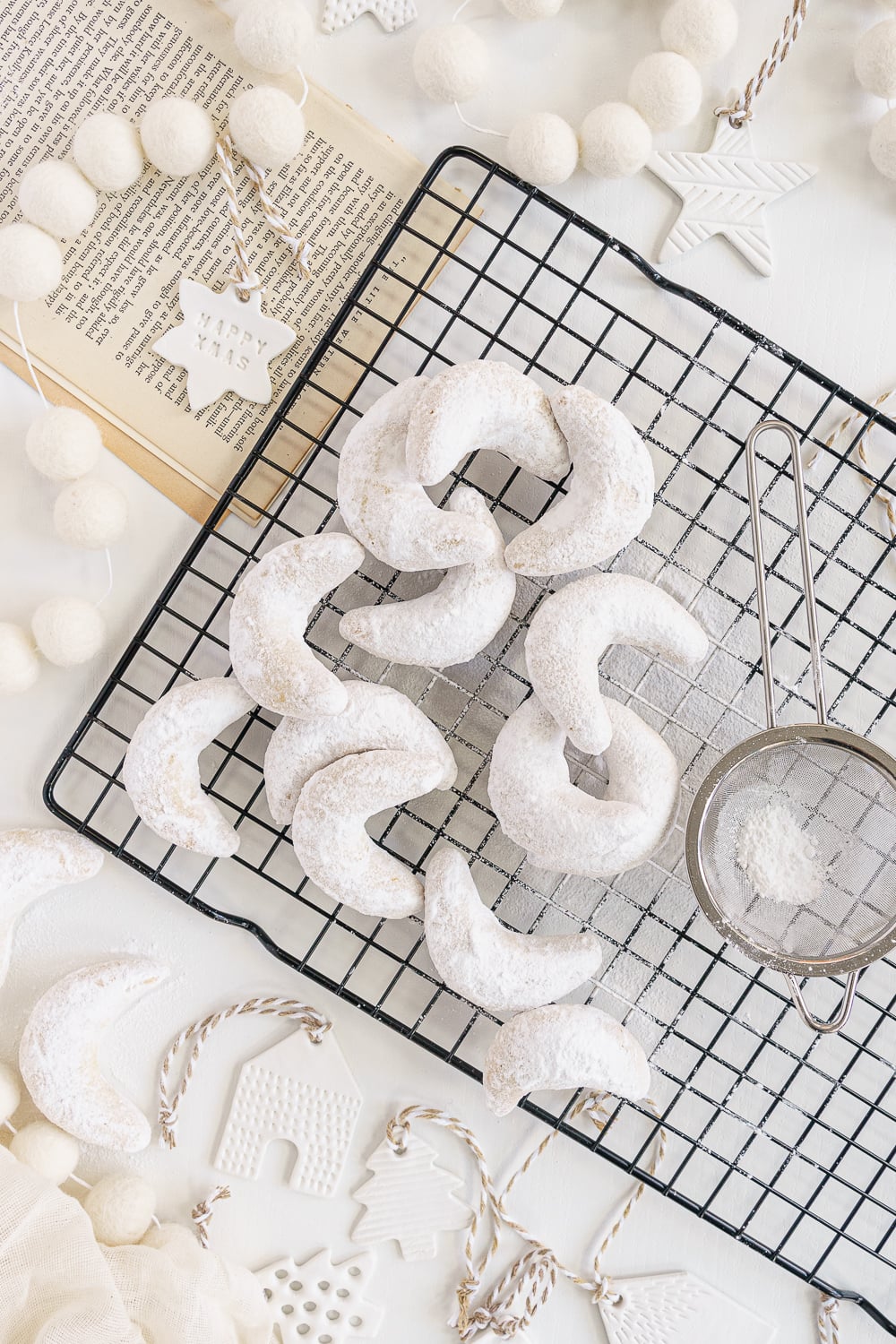 almond crescent cookies on a cooling rack