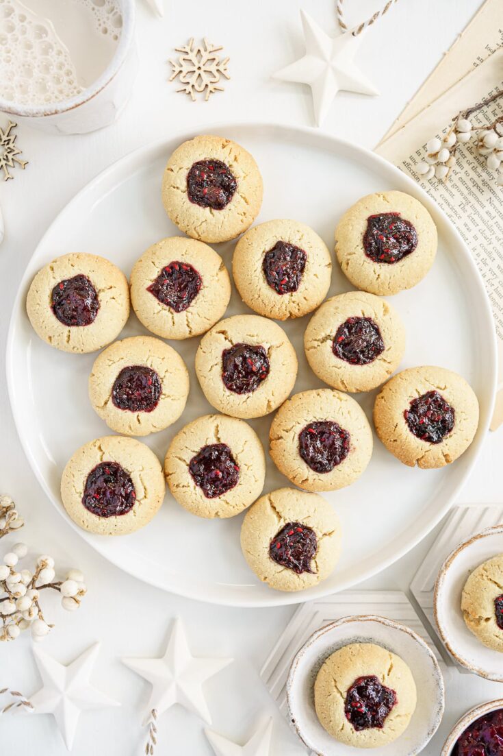plate filled with almond thumbprint cookies