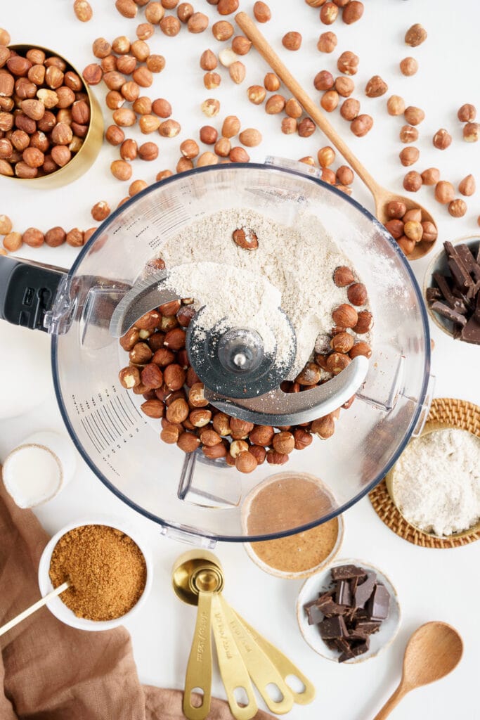 blender bowl with flour and hazelnuts