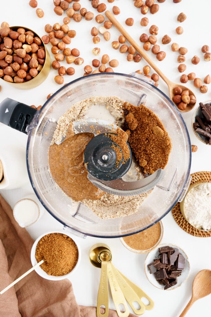 bowl with all ingredients needed to make hazelnut gingerbread man cookies