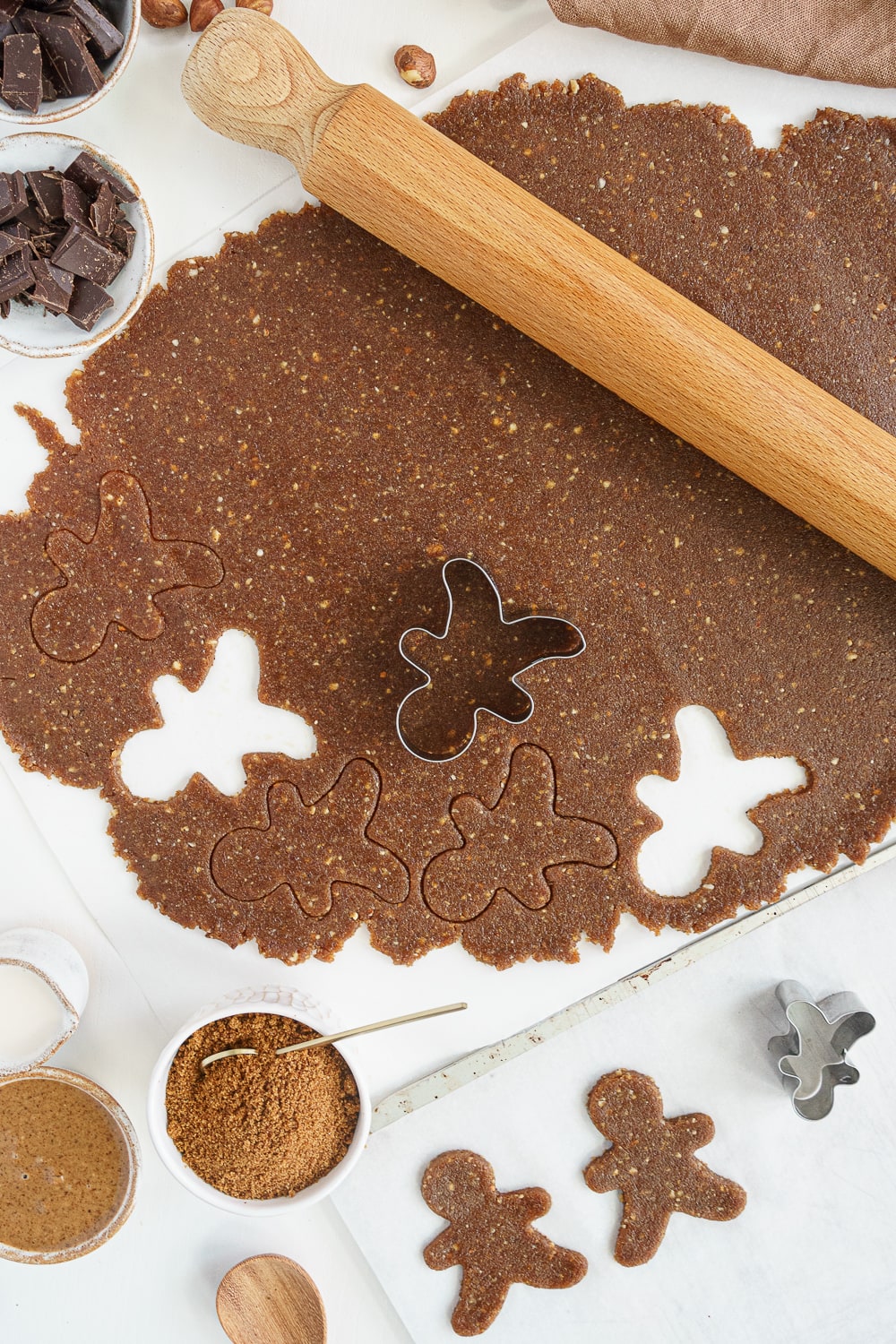 Rolling the dough flat to cut cookies