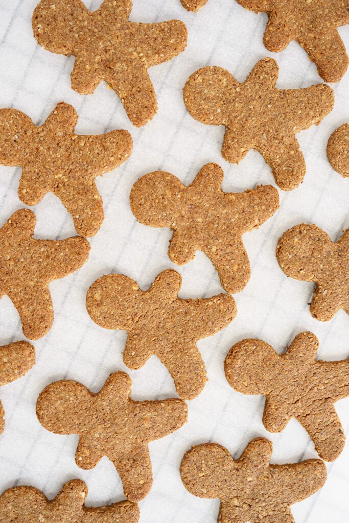 Baked gingerbread man cookies on a wire rack