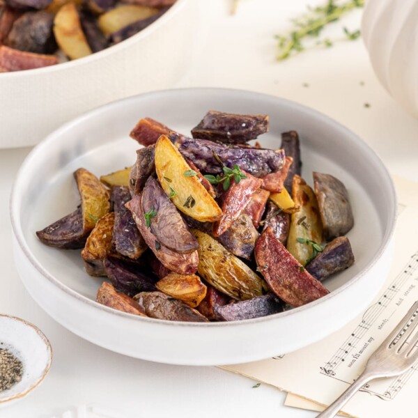 roasted rainbow potatoes in a white plate
