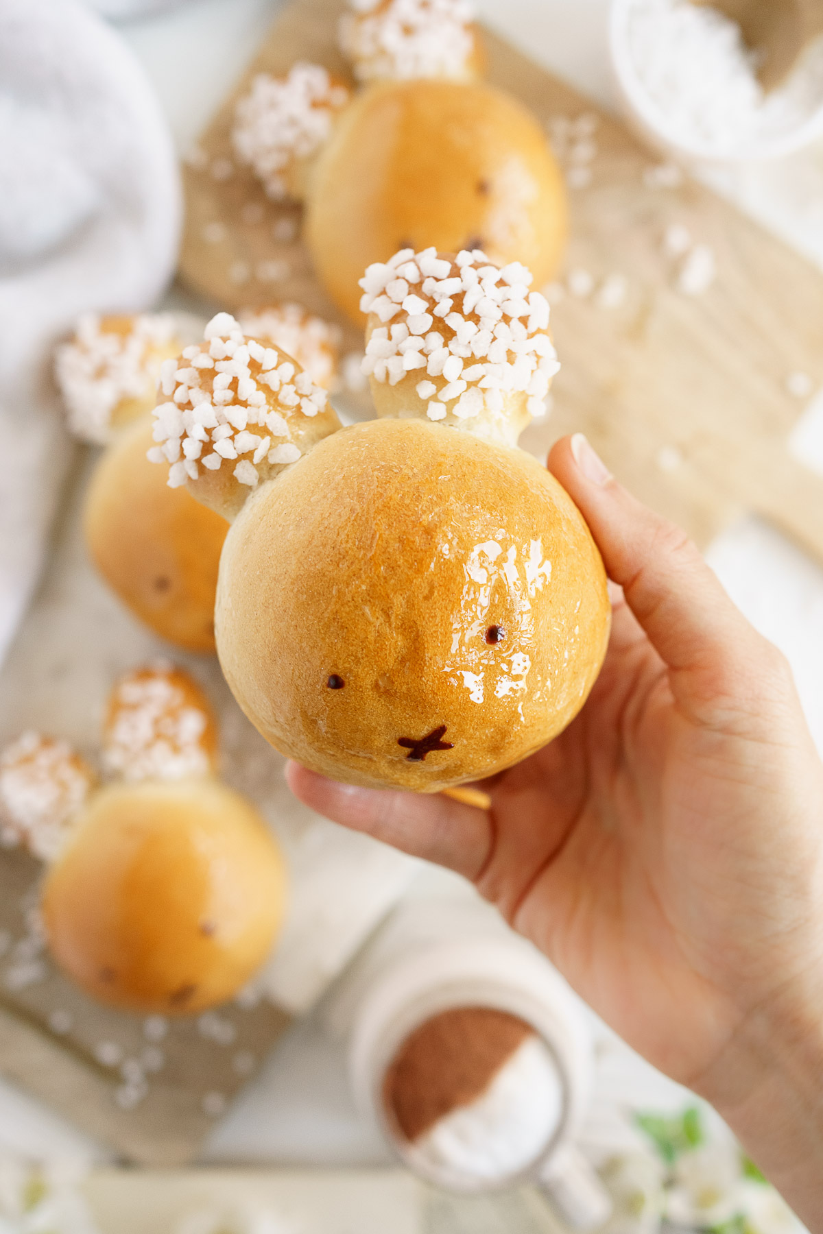 Hand holding a vegan brioche bunny.