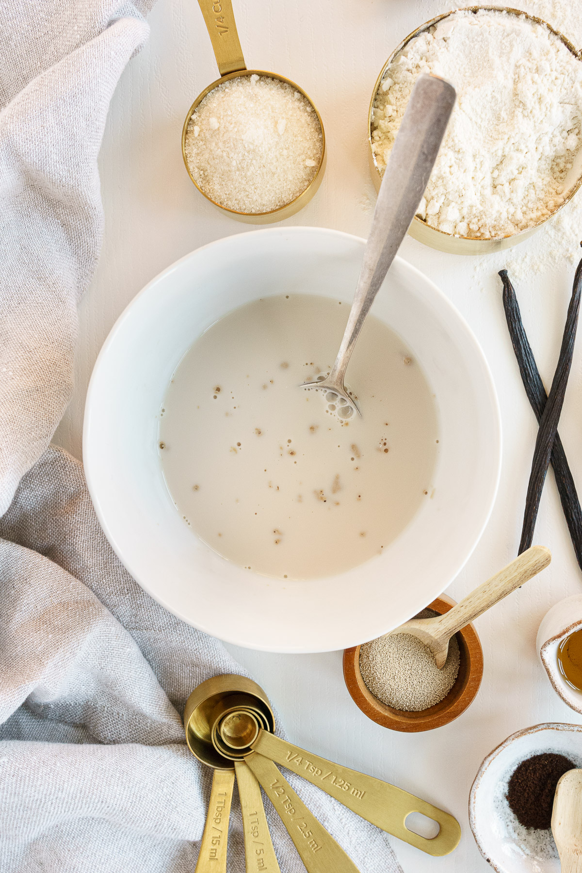 Yeast and milk in a small bowl.