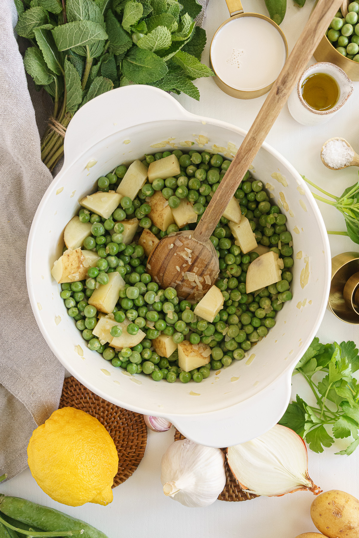 Peas and potatoes cooking in the pot.