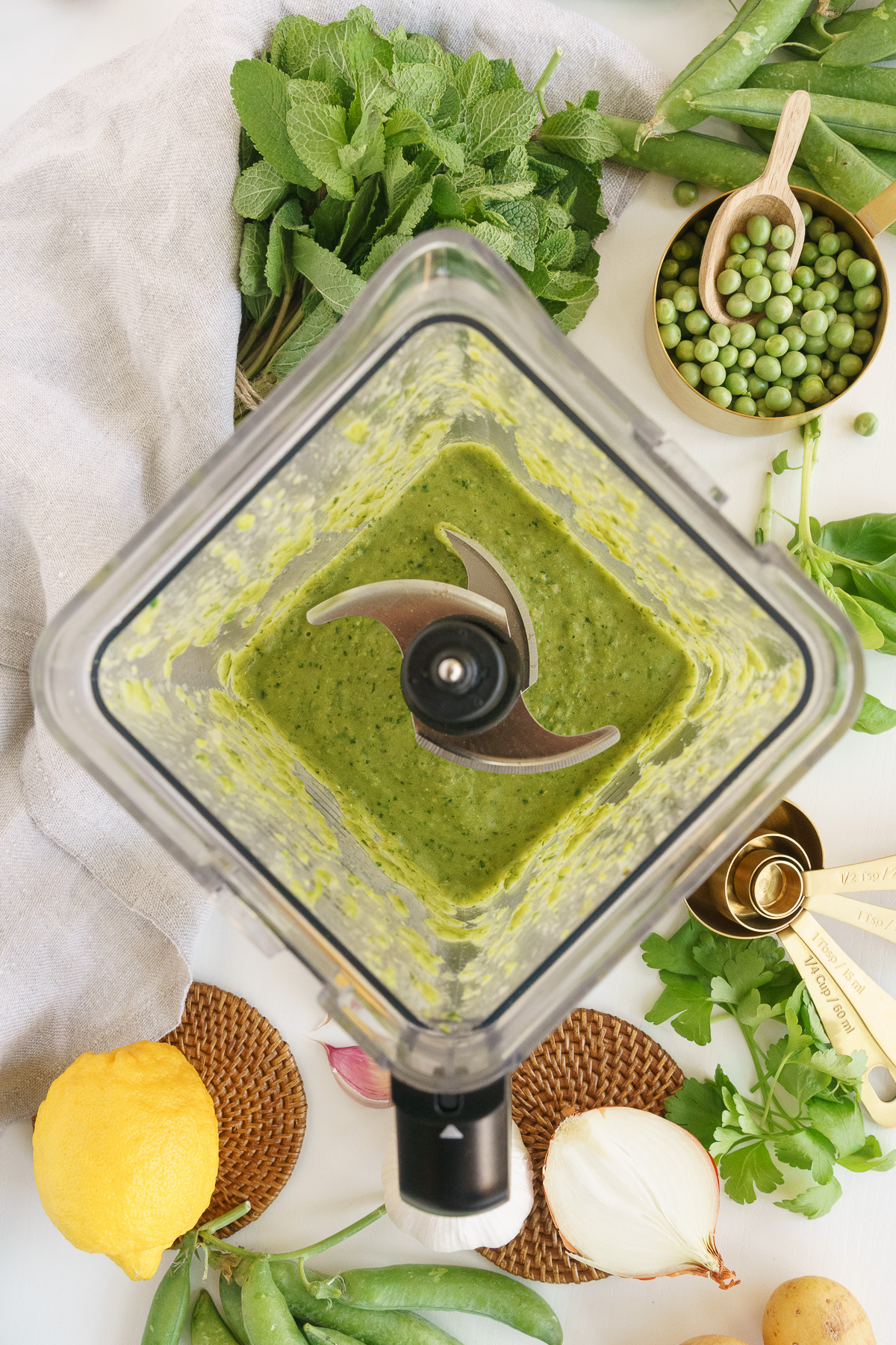 Blending the fresh pea soup up nice and creamy.