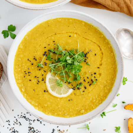 Bowl of middle eastern lentil soup on the table ready to eat.