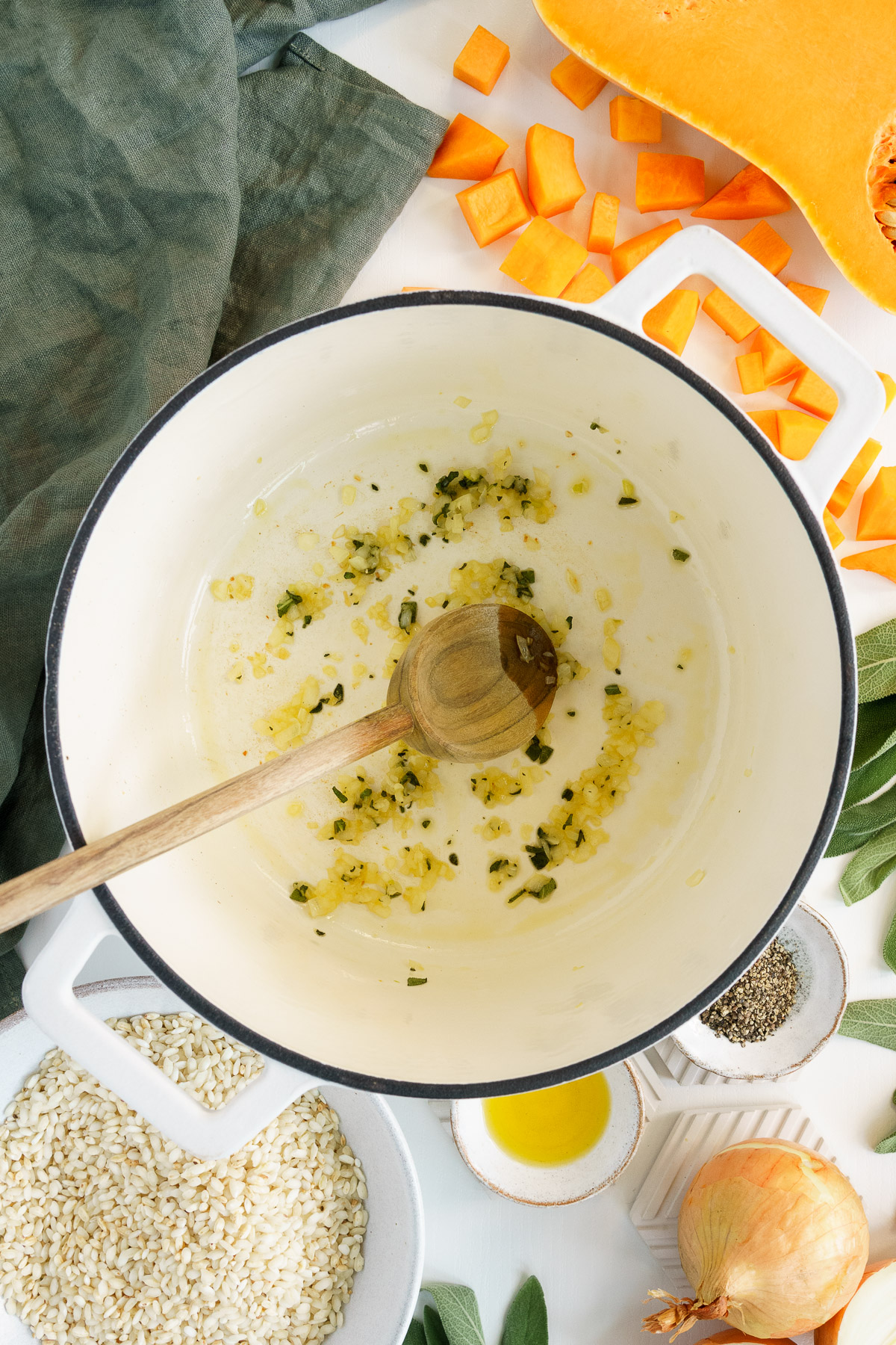 Cooking onions and sage for butternut squash risotto.