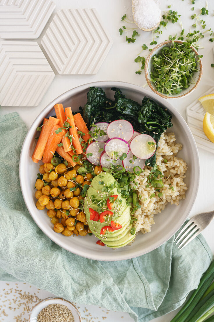 Buddha bowl with chickpeas, avocado, veggies and grains.