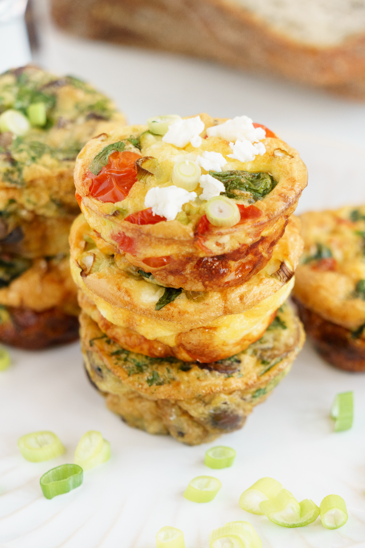 Three flavors of healthy egg muffins stacked on the table.