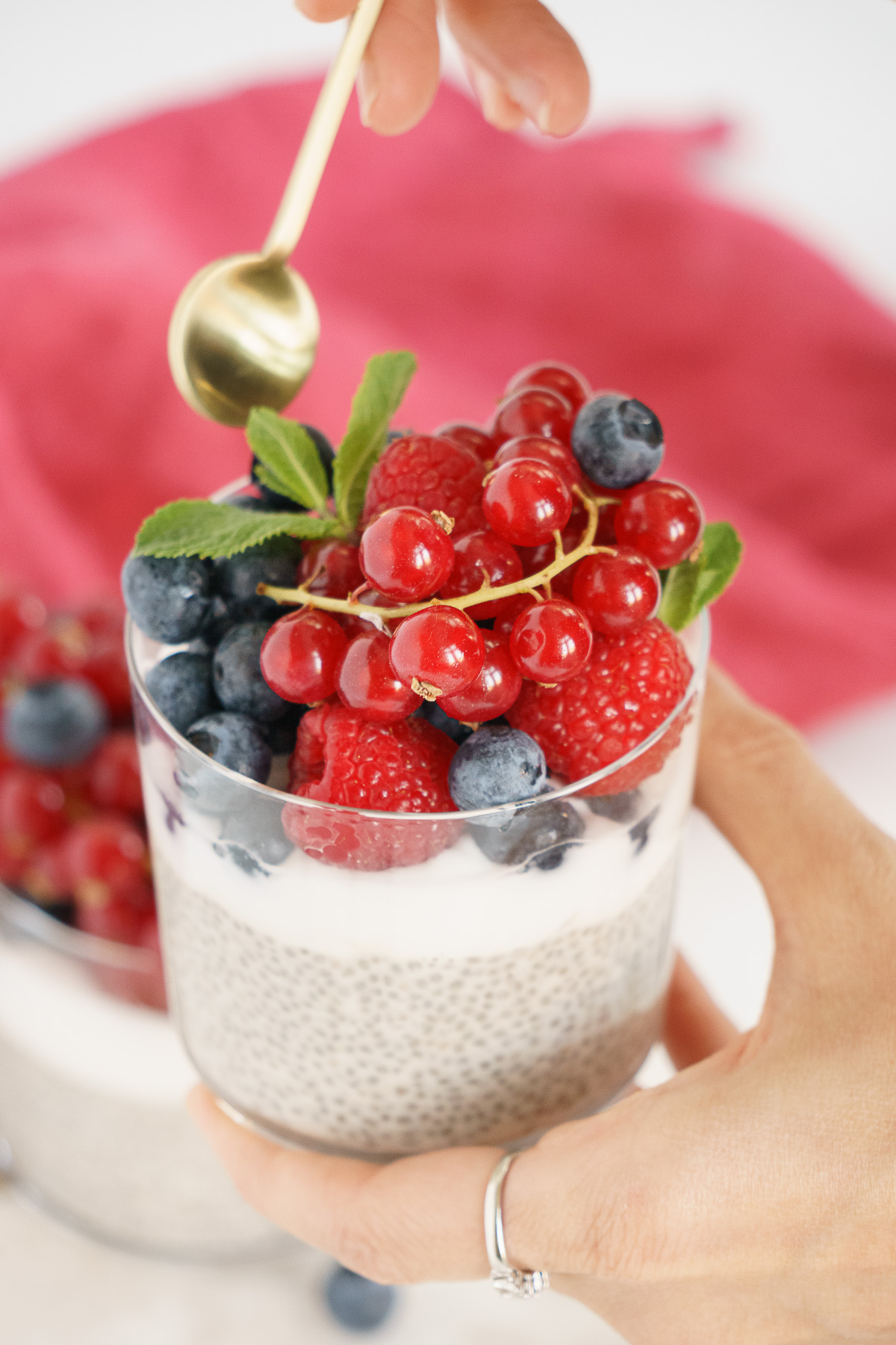 Spoon dipping into eat a bite of vanilla chia pudding.