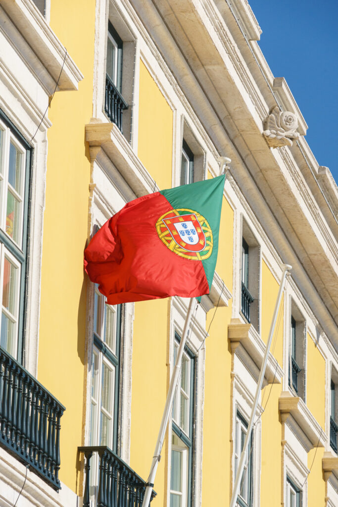 A Pombaline-styled building with Portugal's flag